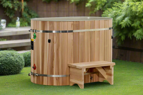 Cedar wood cold plunge barrel with stainless steel bands, glass top, and wooden step stool on white background