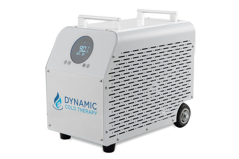 White Dynamic Cold Therapy machine with digital display showing temperature, perforated metal panel, blue logo, control butto