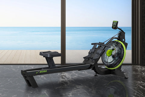 Black and neon green M350 rowing machine with large circular fan wheel, digital display console, and ergonomic seat on white 