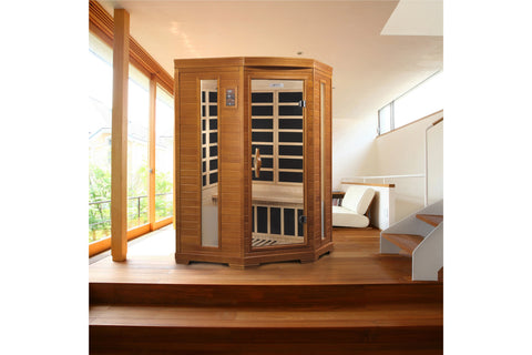 Two-person cedar infrared sauna with glass front doors, black heating panels visible inside, digital control panel, and light