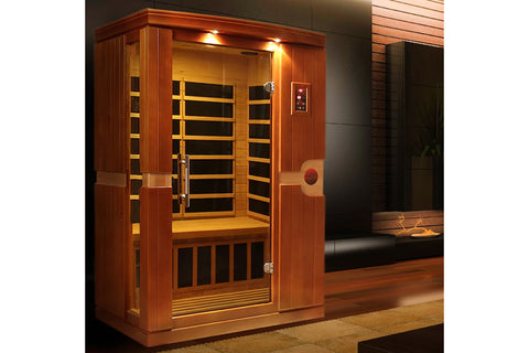 Wooden infrared sauna cabin with hemlock exterior, glass door with wooden frame, interior bench seating, control panel on rig