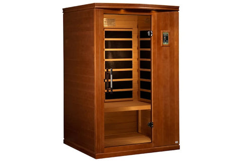 Two-person infrared sauna with warm hemlock wood exterior, glass door with black heating elements visible inside, digital con