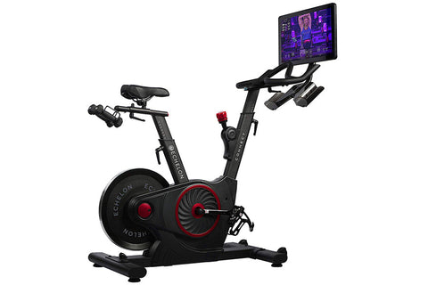 Black and red stationary exercise bike with tablet holder displaying workout screen, on white background