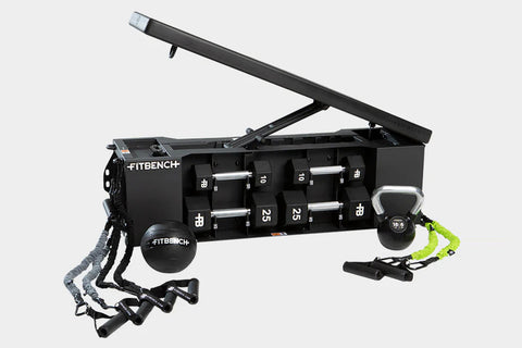 Black FITBENCH weight bench with numbered dumbbell storage, hinged seat back, attached suspension straps and neon green handl
