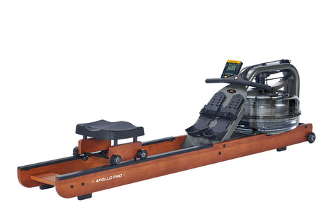 Apollo Pro rowing machine with wood-grain finish, digital display, and dual foot pedals on white background