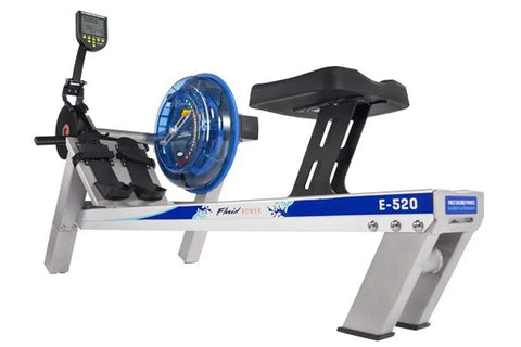 FluidRower E520 Evolution commercial rowing machine with gray frame, blue accents, digital monitor, and black footrest on whi