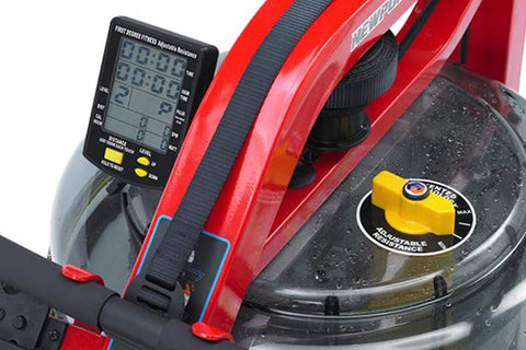 A red and black FluidRower Newport Challenge AR Rower with a black seat and a clear water tank in the center