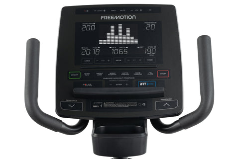 Black recumbent exercise bike with mesh backrest, digital console display, and pedal straps on white background