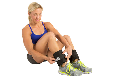 GoFit adjustable ankle weights set with black neoprene pouches and carrying bag on white background