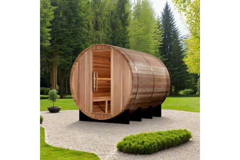 Golden Designs Klosters barrel sauna with cedar wood exterior, open door revealing wooden interior benches, on white backgrou