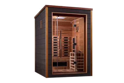 Two-person infrared sauna with dark gray exterior, wood trim, and glass door revealing cedar interior with heating panels and