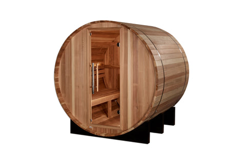 Golden Designs St. Moritz barrel sauna with cedar wood construction, open door showing interior benches, on black support fra