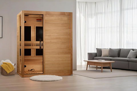 Natural cedar wood infrared sauna with glass-door cabin, wooden bench seating, and black interior, shown on white background