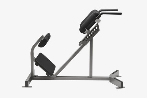 Black and gray Hammer Strength back extension machine with adjustable back pad, footplate, and handlebar on white background