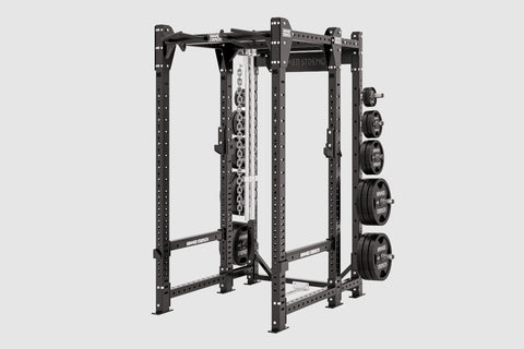 Black power rack with perforated uprights, adjustable safety bars, cable machine attachment on center post, and weight plate 