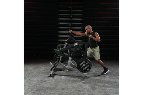 Hammer Strength plate-loaded combo twist machine with black steel frame and weighted plates, front view on white background