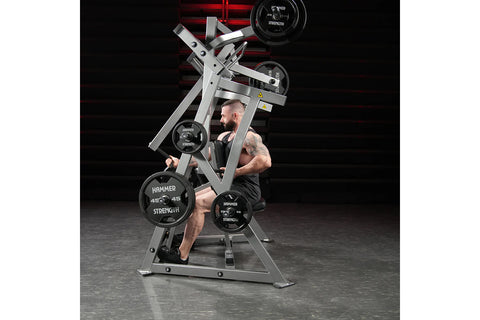 Black plate-loaded iso-lateral D.Y. row machine with dual handles, foot plate, and metal frame on white background