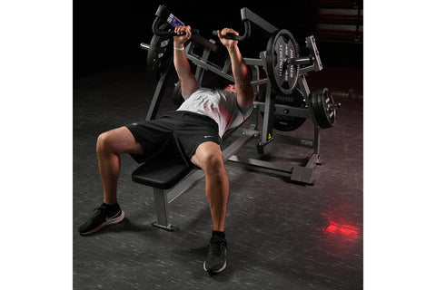 Black Hammer Strength plate-loaded iso-lateral horizontal bench press with padded seat, chrome handles, and steel frame on wh
