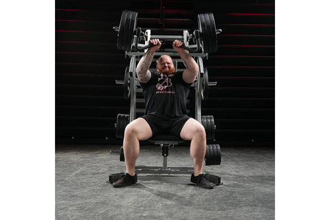 Black Hammer Strength plate-loaded iso-lateral incline press machine with chrome handles and adjustable seat, on white backgr