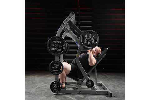 Black Hammer Strength plate-loaded iso-lateral shoulder press machine with padded seat, dual handles, and weight plate posts,