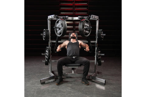 Black Hammer Strength plate-loaded iso-lateral wide chest press machine with weight plates and padded seat, isolated on white