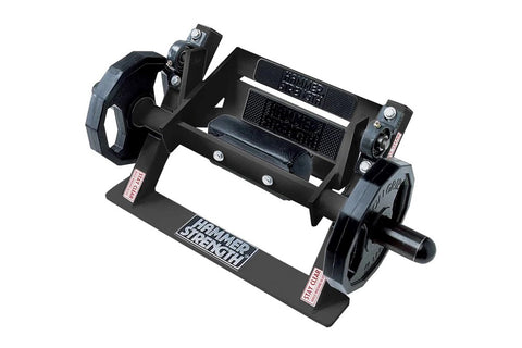 Black Hammer Strength plate-loaded tibia dorsi flexion machine with metal frame, foot platform, and adjustment handles on whi