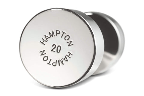 Pair of chrome dumbbells with black contoured grips and cylindrical weights on white background