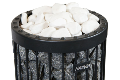 Harvia sauna heater bucket with white rounded stones and black metal rim studded design on white background