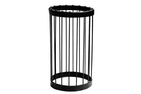 Black cylindrical metal cage with vertical bars and studded top rim, flat lay on white background