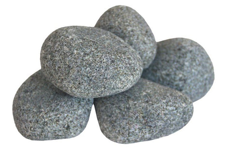 Harvia sauna heater stones in black metal basket with rounded gray stones, flat lay on white background