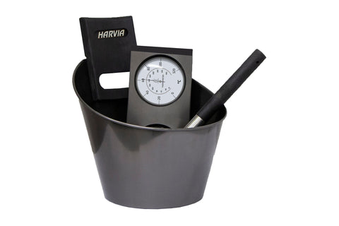 Harvia sauna accessory set in black steel with gray bucket, thermometer, ladle, and cushion on white background