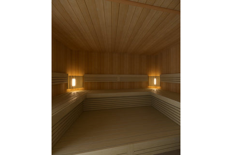 Harvia sauna lamp shade corner made of eight natural wood slats arranged in curved formation on white background