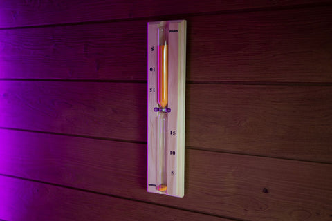 Harvia wooden sauna sand timer with red sand and brass accents on white background