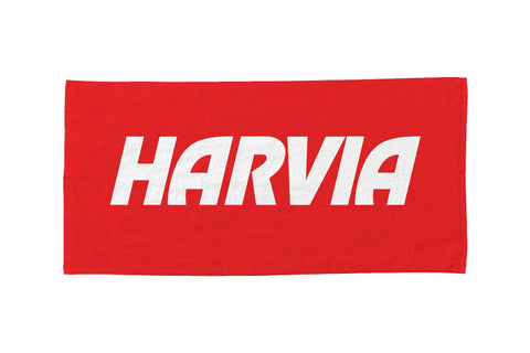 Red towel with white Harvia text, flat lay on white background