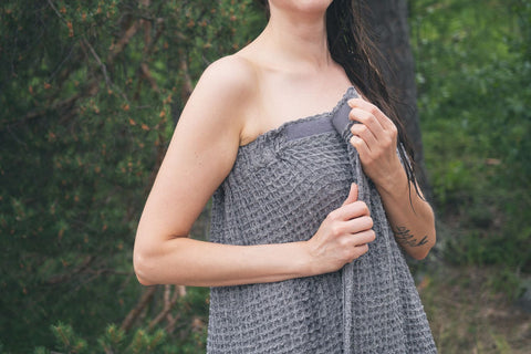 Harvia Sauna Wrap Towel in charcoal gray, 75% cotton 25% linen blend, displayed with product packaging on white background