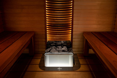 Harvia The Wall illuminated glass sauna heater with white frosted glass panel, red power cord, white mounting bracket, and bl