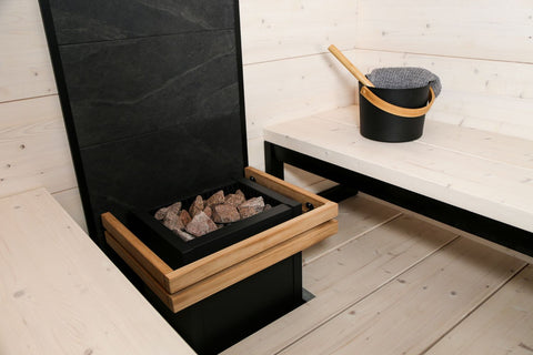 Natural wood sauna safety railing with black metal brackets and hardware on white background