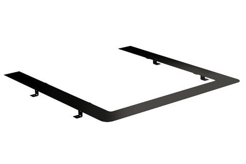Black metal embedding flange with white insert surface and mounting tabs, isometric view on white background