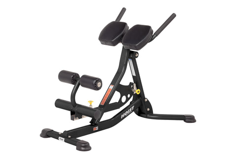 Black Hoist ab and back Roman hyperextension bench with padded backrest, leg press attachment, and stable base on white backg