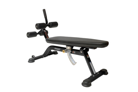 Hoist adjustable abdominal bench with black padded seat, dual rotating leg attachment arms, and foam foot platform on white b