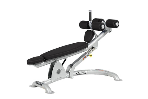 Hoist adjustable decline ab bench with silver metal frame, black padded seat and backrest, adjustable leg extension with blac