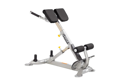 Hoist CF-3663 back hyperextension machine with silver frame, black padded seat and backrest, on white background