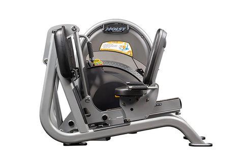Hoist CL-3403 leg press machine with silver frame, black seat, and yellow and black safety labels on white background