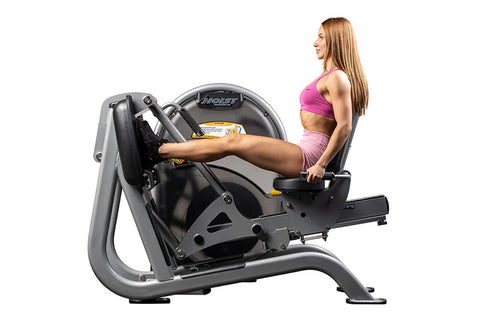 Hoist CL-3403 leg press machine with silver frame, black seat, and yellow and black safety labels on white background