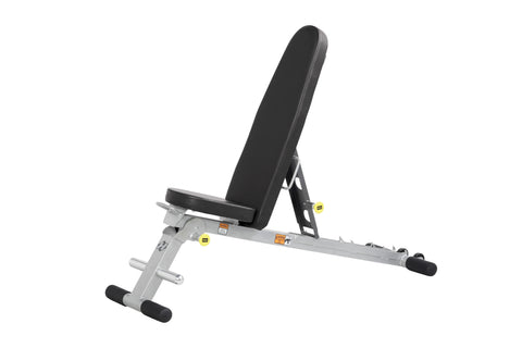 Hoist Folding Multi-Bench with black padded backrest and seat, silver metal frame, yellow safety labels, and black foot pads 