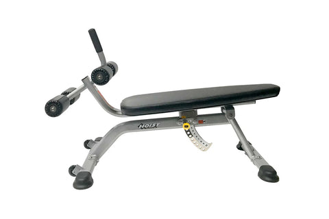 Hoist adjustable abdominal bench with black padded seat, dual rotating leg attachment arms, and foam foot platform on white b