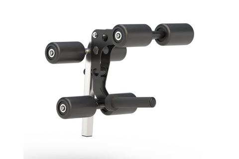 Black and gray leg extension and leg curl attachment with cylindrical rollers and white mounting post, on white background