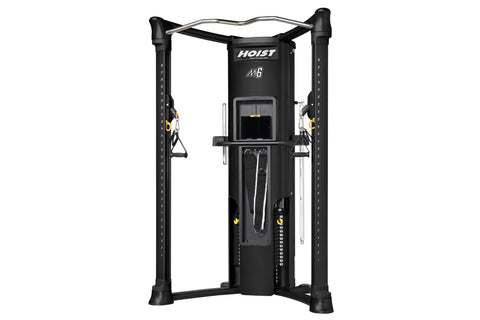 Hoist Mi6 functional trainer with black frame, dual cable towers, silver curved top bar, and yellow accents on white backgrou