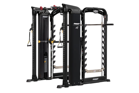 Hoist MI7 Smith functional trainer with black frame, cable stations with yellow pulleys, red adjustment knobs, and tan foot p