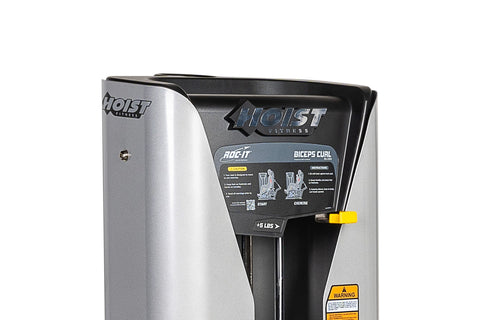 Hoist ROC-IT Biceps Curl Machine with silver frame, black padded seat and backrest, weight stack on white background